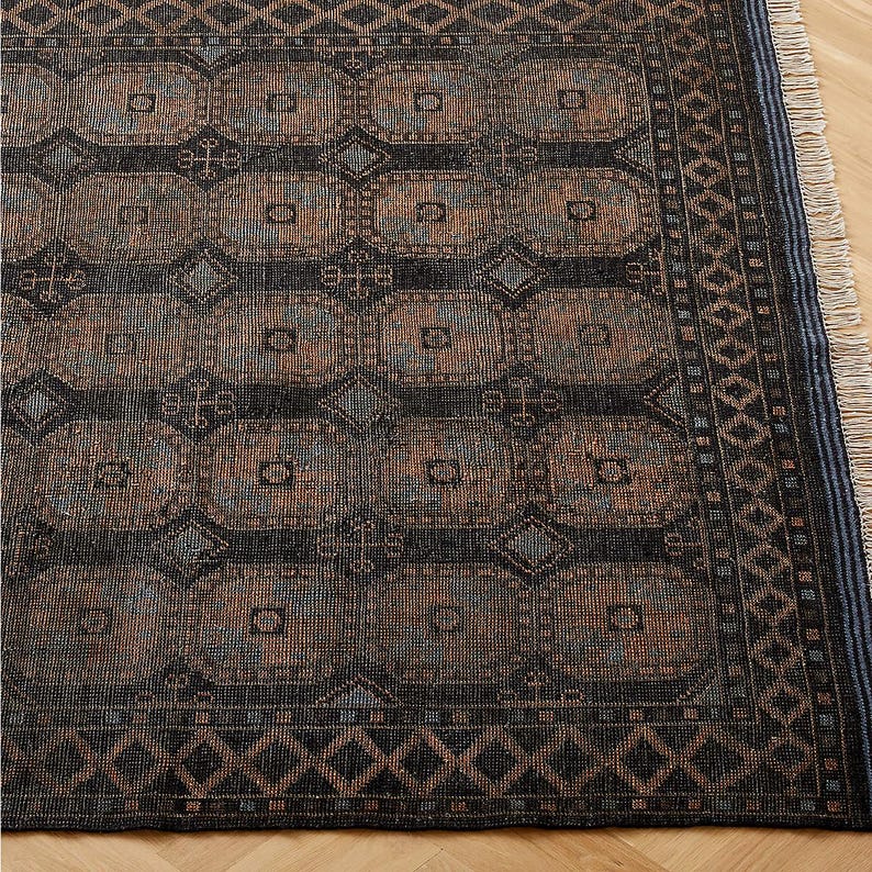 Patterned rug with geometric design on a wooden floor